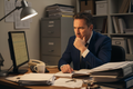 Manager Staring Puzzled at Computer Screen